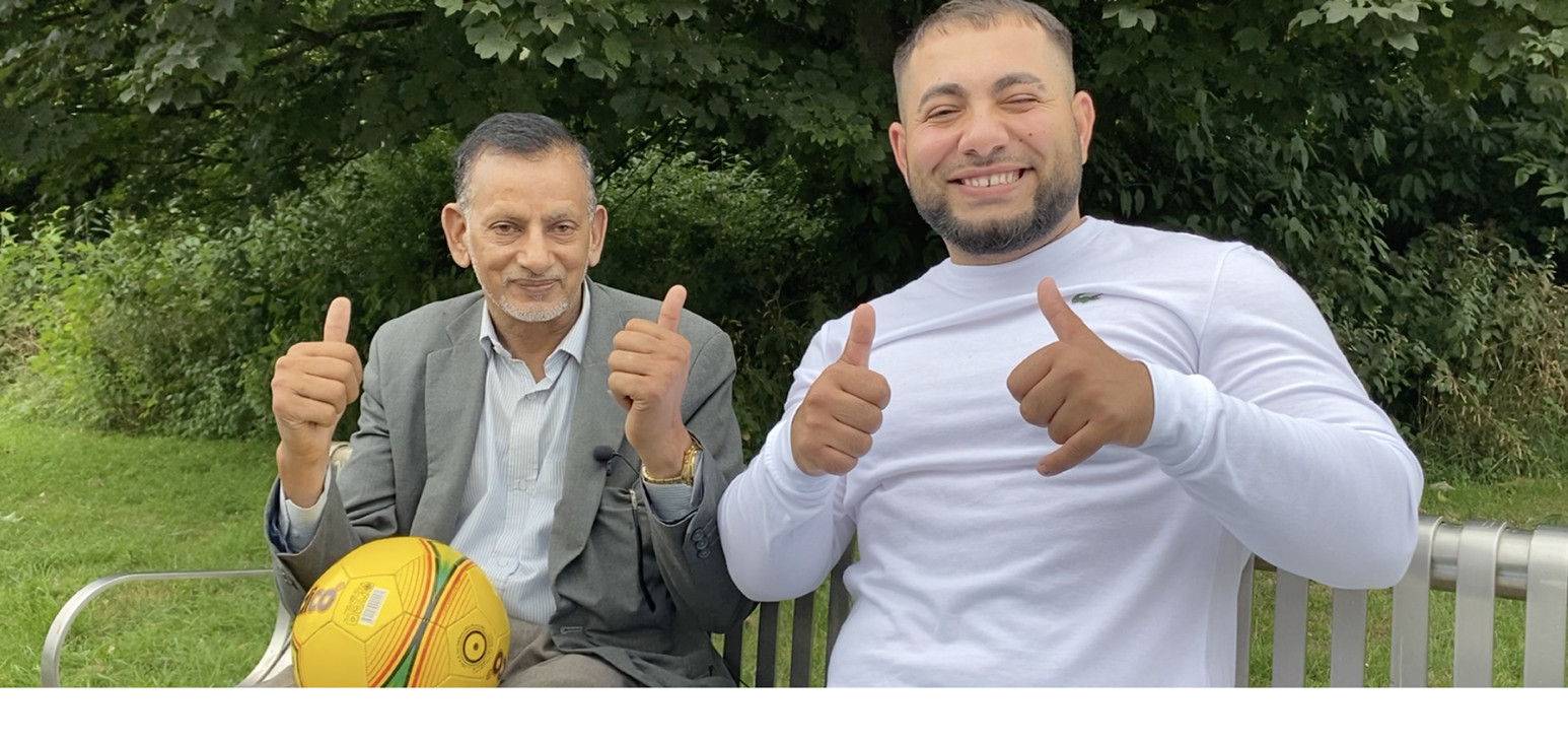 two men with thumbs up