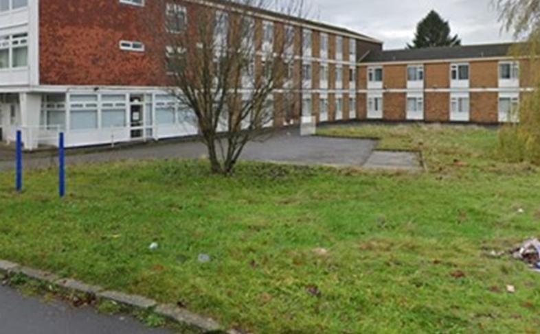 Castelayne Care Home with communal gardens in the foreground