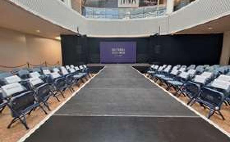 A large room featuring a catwalk.