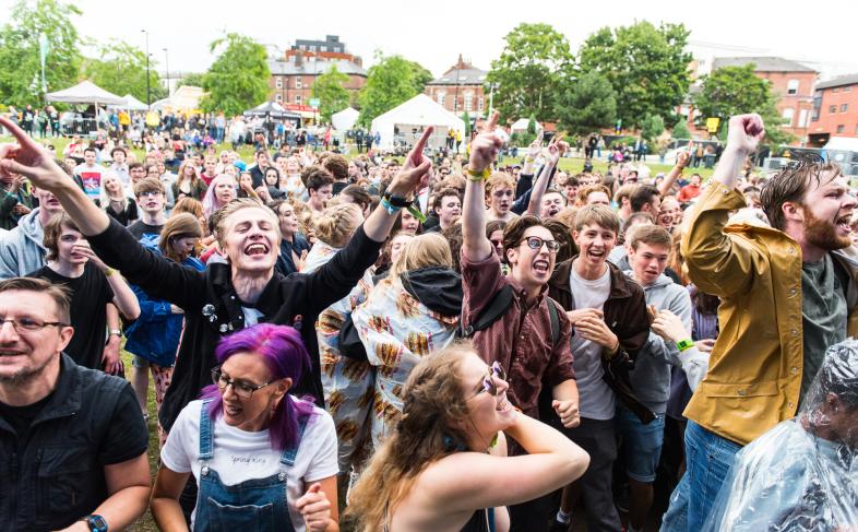 A crowd of people enjoying an event at Devonshire Green