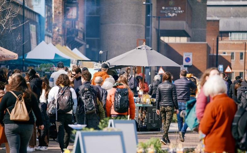 Visitors stroll through a market in Sheffield.