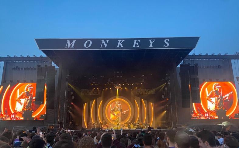 The Arctic Monkeys performing on stage.