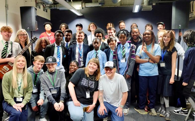 Ed Sheeran poses for a picture with musicians at Red Tape Studios.