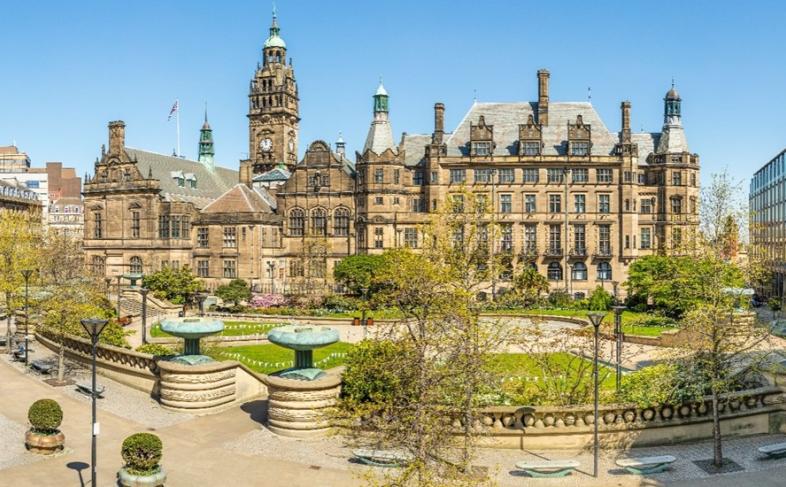 Sheffield Peace Gardens on a sunny day with the Town Hall in the background. 