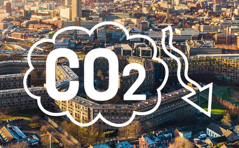 Bird's eye view of Sheffield with the word CO2 overlayed and an arrow pointing down