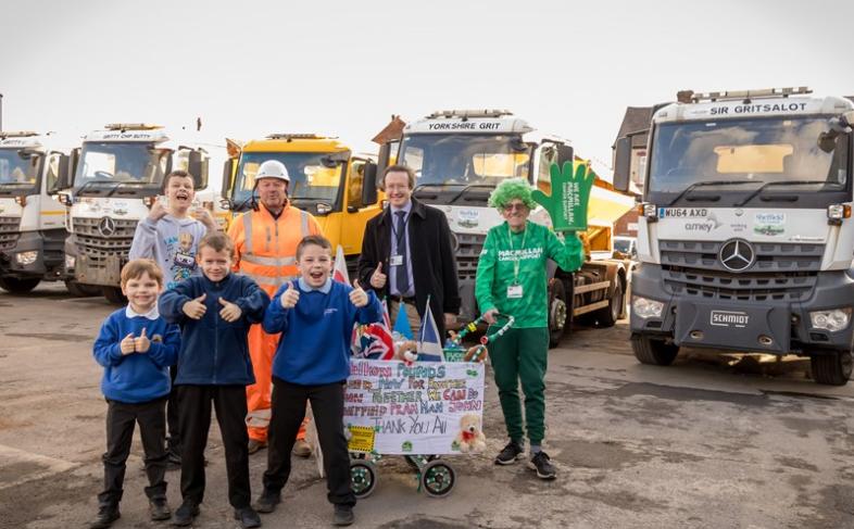 John Kirk, winter maintenance manager at Amey, Councillor Joe Otten, chair of Sheffield City Council's Waste and Street Scene Policy committee and charity fundraise John Burkhill with local children who helped name the Streets Ahead gritters