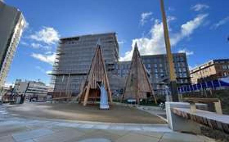 Sheffield city centre's Pound's Park stands empty on a beautiful sunny day as the light reflects off the clouds