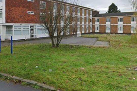 Castelayne Care Home with communal gardens in the foreground