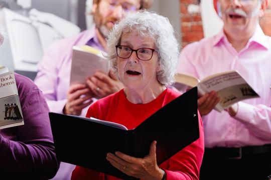 A group of people singing from the Oxford Book of Tudor Anthems.Credit James Stanthorpe