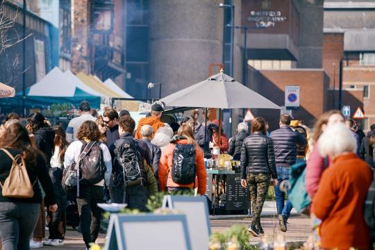 Visitors stroll through a market in Sheffield.