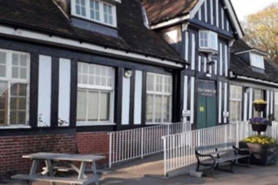 Front of the Rose Garden cafe Graves Park. A black and white tudor style building