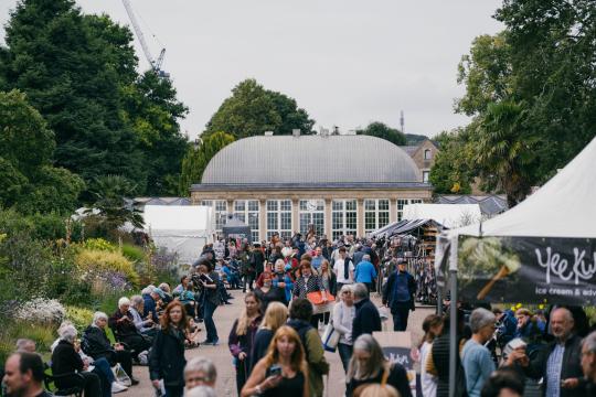 Crowds of people at an event at Sheffield Botanical Gardens