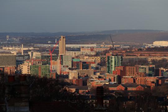 High rise buildings in Sheffield City Centre with rolling hills in the background