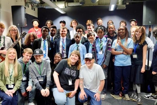 Ed Sheeran poses for a picture with musicians at Red Tape Studios.