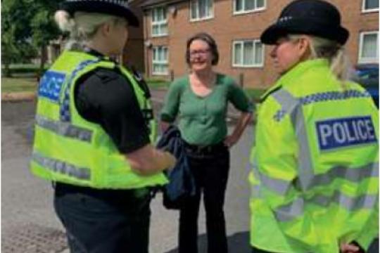 Cllr Alison Norris speaks to two police officers