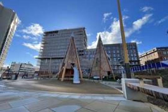 Sheffield city centre's Pound's Park stands empty on a beautiful sunny day as the light reflects off the clouds