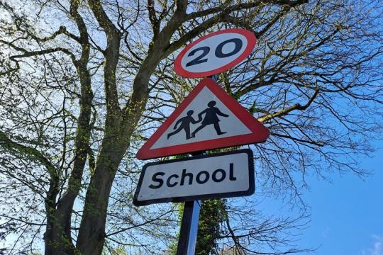 A 20mph road sign warning of a school nearby.