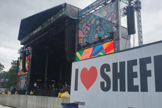 Tramlines main stage in Hillsborough Park. A sign says I heart Sheff.